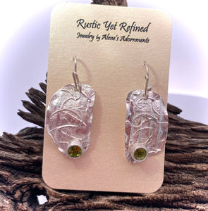 peridot gemstone earrings shown on romance card