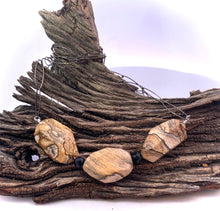 Load image into Gallery viewer, Necklace with stone pendants on a piece of driftwood
