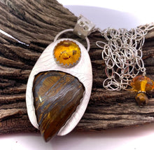 Load image into Gallery viewer, tiger iron pendant in natural setting