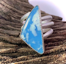 Load image into Gallery viewer, cloud dreams spiral ring shown in natural setting