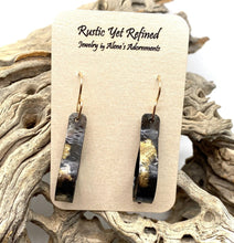 Load image into Gallery viewer, golden steel earrings shown on romance card