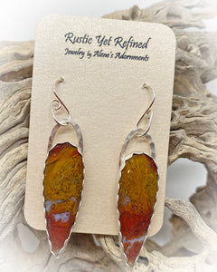 red moss agate earrings shown in natural setting