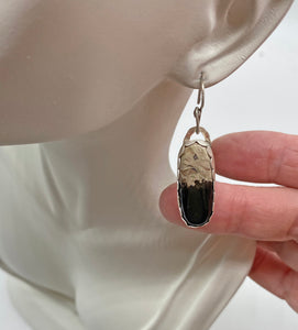 sterling palmwood gem earrings on ear lobe