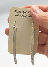 Load image into Gallery viewer, super skinny earrings shown on card and held in hand