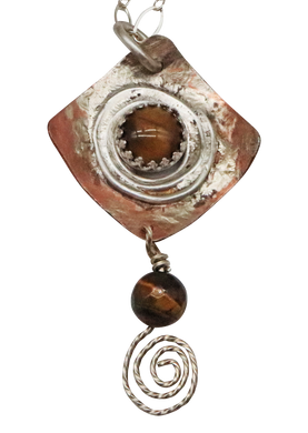 closeup of tigers eye pendant spiral design