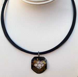 honeycomb pendant shown on bust