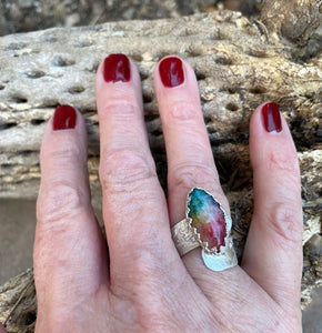 solar quartz ring on finger