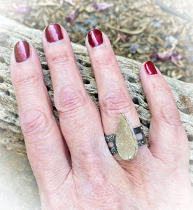 steel and druzy ring on hand