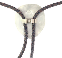 Load image into Gallery viewer, Bolo tie with braided leather straps and silver clasp on a white background