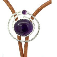 Load image into Gallery viewer, Bolo tie with an amethyst stone and silver circle on a white background