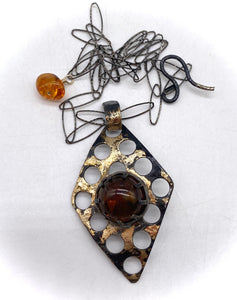 Amber pendant showing neck chain