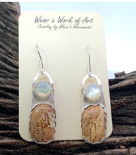 Load image into Gallery viewer, Pair of earrings on a display card with &#39;Wear a Work of Art&#39; text, placed on wooden surface.