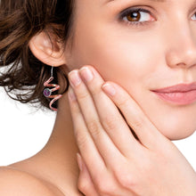 Load image into Gallery viewer, Close-up of a woman wearing a copper earring with a ruby zoisite gemstone 