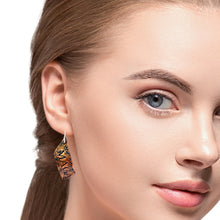 Load image into Gallery viewer, Close-up of a woman wearing an earring with a neutral background