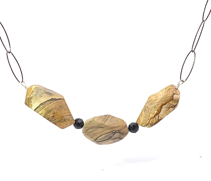 Necklace with stone beads on a white background