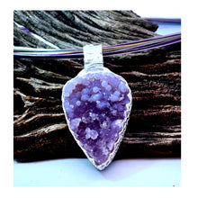 Load image into Gallery viewer, Amethyst crystal pendant on a wooden background