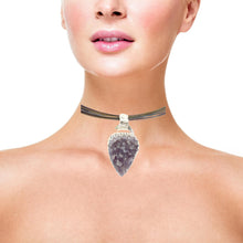 Load image into Gallery viewer, Necklace with a purple crystal pendant worn by a model on a white background