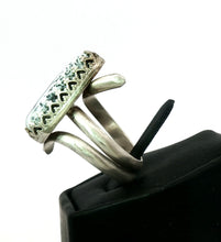 Load image into Gallery viewer, Silver ring with dendritic opal gem on black stand a view from side