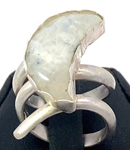 Load image into Gallery viewer, Silver ring with a large moonstone on a black stand