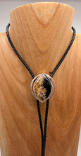 Load image into Gallery viewer, Bolo tie with a natural petrified palmwood stone design on a wooden block