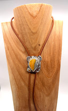 Load image into Gallery viewer, bolo tie with a silver bumblebee jasper gem  on a wooden stand