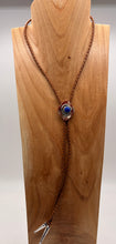 Load image into Gallery viewer, bolo tie  with a bluelapis gem on a wooden mannequin
