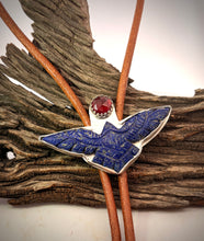 Load image into Gallery viewer, A close-up of a silver framed eagle bolo tie with a deep blue inlay and  garnet gemstone, 