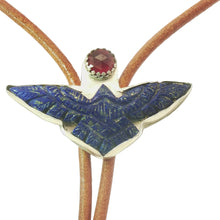 Load image into Gallery viewer, A close-up of a bolo tie featuring a silver framed eagle pendant with blue lapis lazuli-style inlay and a faceted garnet  gemstone at the center, 