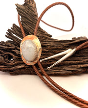 Load image into Gallery viewer, Bolo tie with stone and metal design on a wooden background