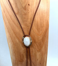 Load image into Gallery viewer, Necklace with a stone pendant on a wooden stand
