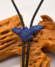 Load image into Gallery viewer, lapis gemstone eagle bolo tie  on a black cord against a wooden background