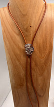 Load image into Gallery viewer, Necklace with a decorative pendant on a wooden stand
