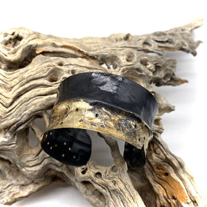golden steel cuff in natural setting