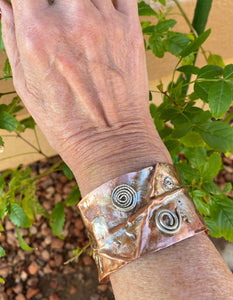 sacred spiral cuff on the wrist