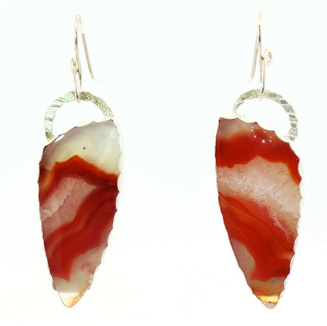 Agate stone earrings with silver loops on a white background