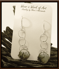 Load image into Gallery viewer, Silver earrings on a jewelry card with nature-themed background