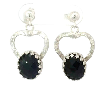 Silver heart-shaped earrings with black gemstones on a white background
