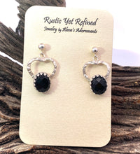 Load image into Gallery viewer, Pair of silver earrings with black stones on a rustic wooden background