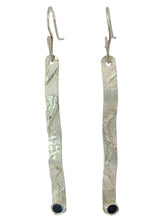 Load image into Gallery viewer, A pair of textured sterling silver dangle earrings with faceted sapphire gemstones.