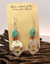 Load image into Gallery viewer, A pair of handmade dangle earrings displayed on a cream-colored jewelry card. The earrings feature a turquoise stone bead, a small copper disc, and a hammered silver heart-shaped pendant.