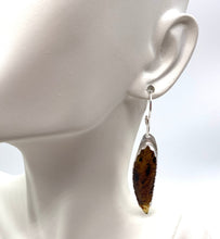 Load image into Gallery viewer, amber earring on lobe