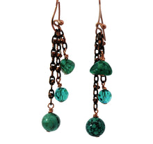 Load image into Gallery viewer, A pair of handmade dangle earrings featuring natural turquoise beads and anqiqued copper links 