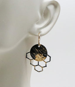 honeycomb earrings shown on lobe