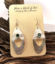 Load image into Gallery viewer, A pair of textured silver dangle earrings with heart-shaped cutouts and s4mm faceted emerald gemstone 