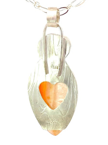 carnelian and moonstone pendant from the back showing the heart cutout