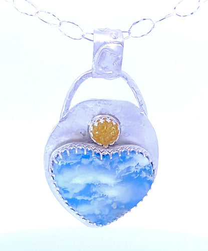 Baltic amber and plume agate pendant