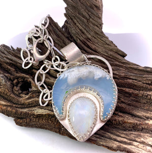 plume agate and moonstone pendant in natural setting