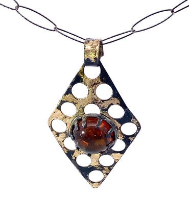18k gold on steel with baltic amber gem