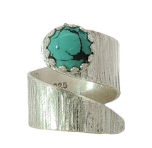 Load image into Gallery viewer, A textured sterling silver wrap ring featuring a round turquoise cabochon with black matrix veining,