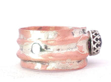 Load image into Gallery viewer, A wide, chunky ring with a textured, hammered finish in a warm copper and sterling.,viewed from the side